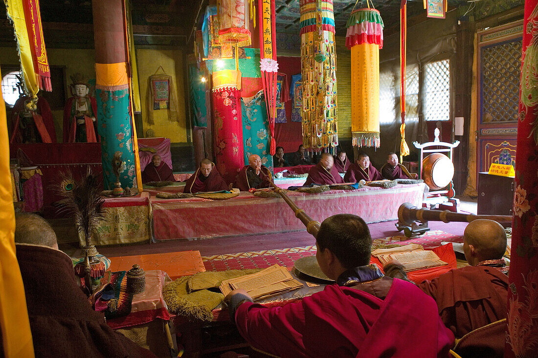 Prayer ceremony in Pusa Ding monastery, yellow cap monks, Wutai Shan, Five Terrace Mountain, Buddhist Centre, town of Taihuai, Shanxi province, China