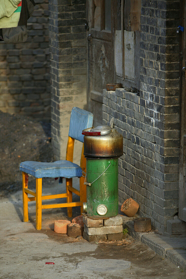 chair and oven, Monastery, Wutai Shan, Five Terrace Mountain, Buddhist centre, town of Taihuai, Shanxi province, China, Asia