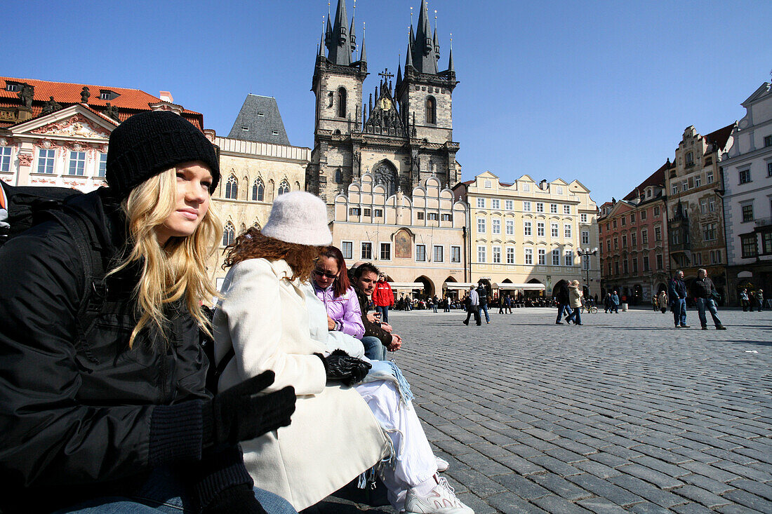 Girls sitting in the Old Town Square, Stare Mesto, Old Town, Prague, Czech Republic