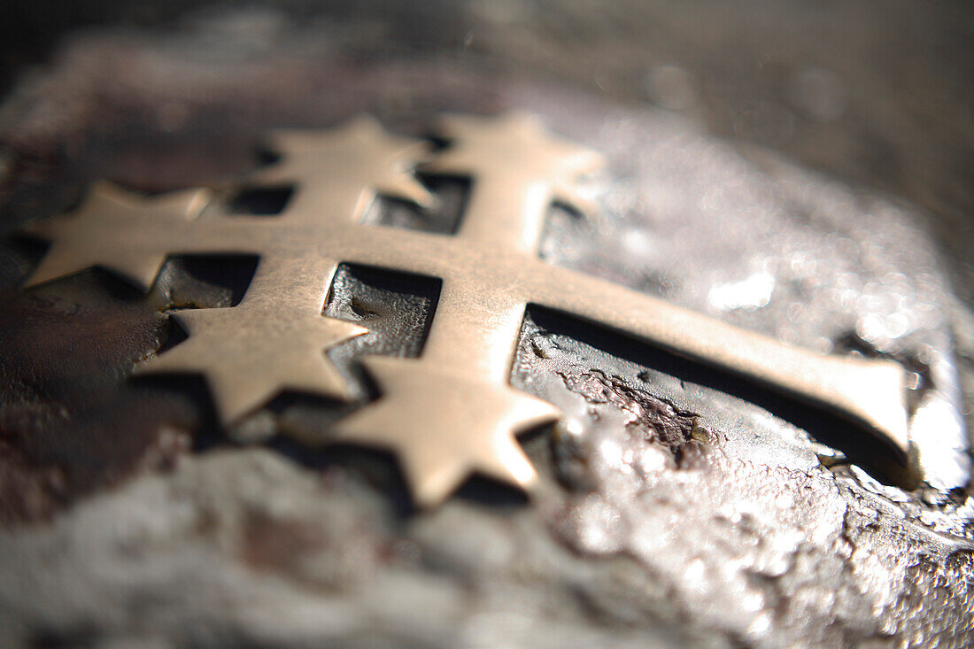 Close up of a cross on Charles Bridge, Prague, Czech Republic