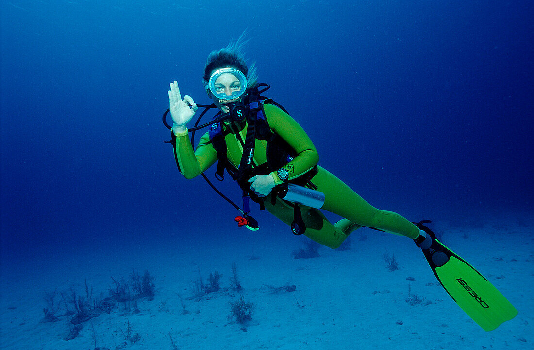 Scuba diver shows o.K. signal, Bahamas, Caribbean Sea, Grand Bahama Island