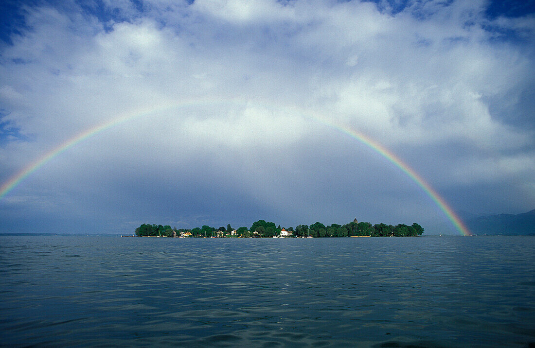 A rainbow over lake Chiemsee, view from the west, Lake Chiemsee, Bavaria, Germany