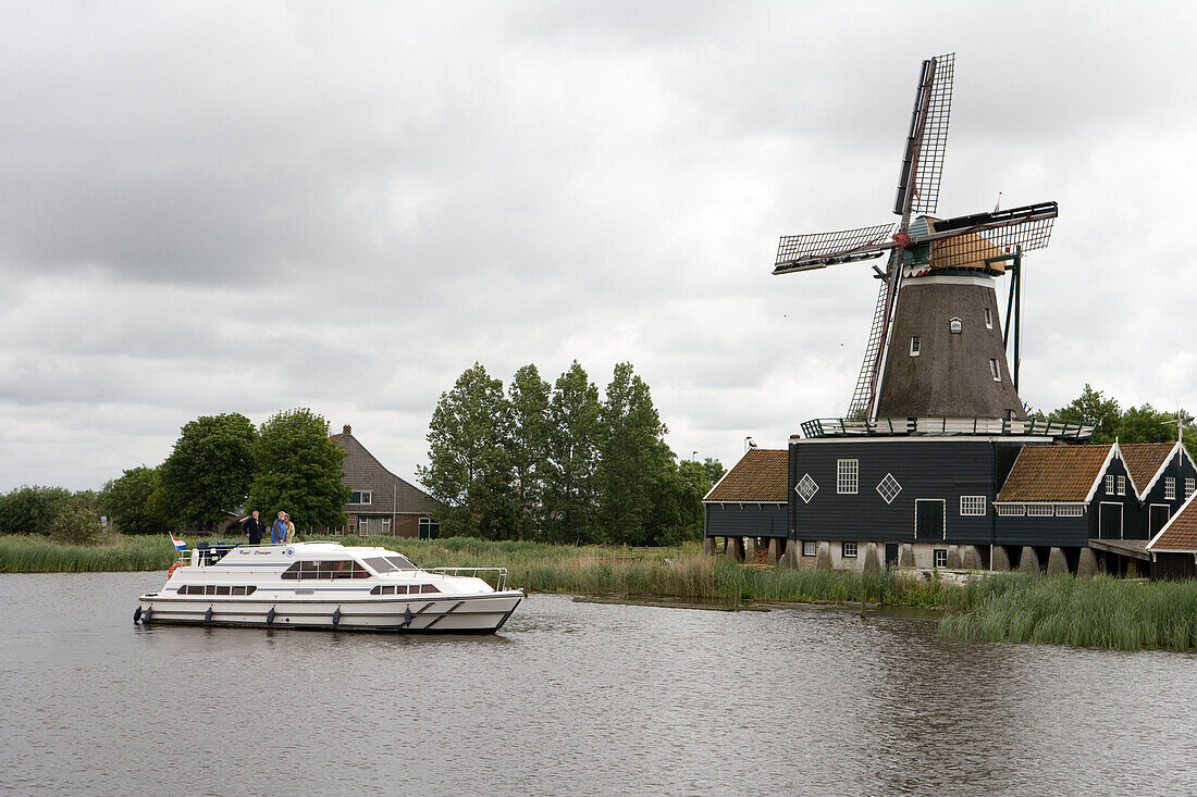 Crown Blue Line Houseboat & Windmill,Geeuw River, Ijlst, Frisian Lake District, Netherlands