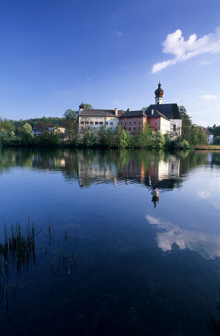 Palace of Hoeglwoerth and reflections in pond, Chiemgau, Upper Bavaria, Bavaria, Germany