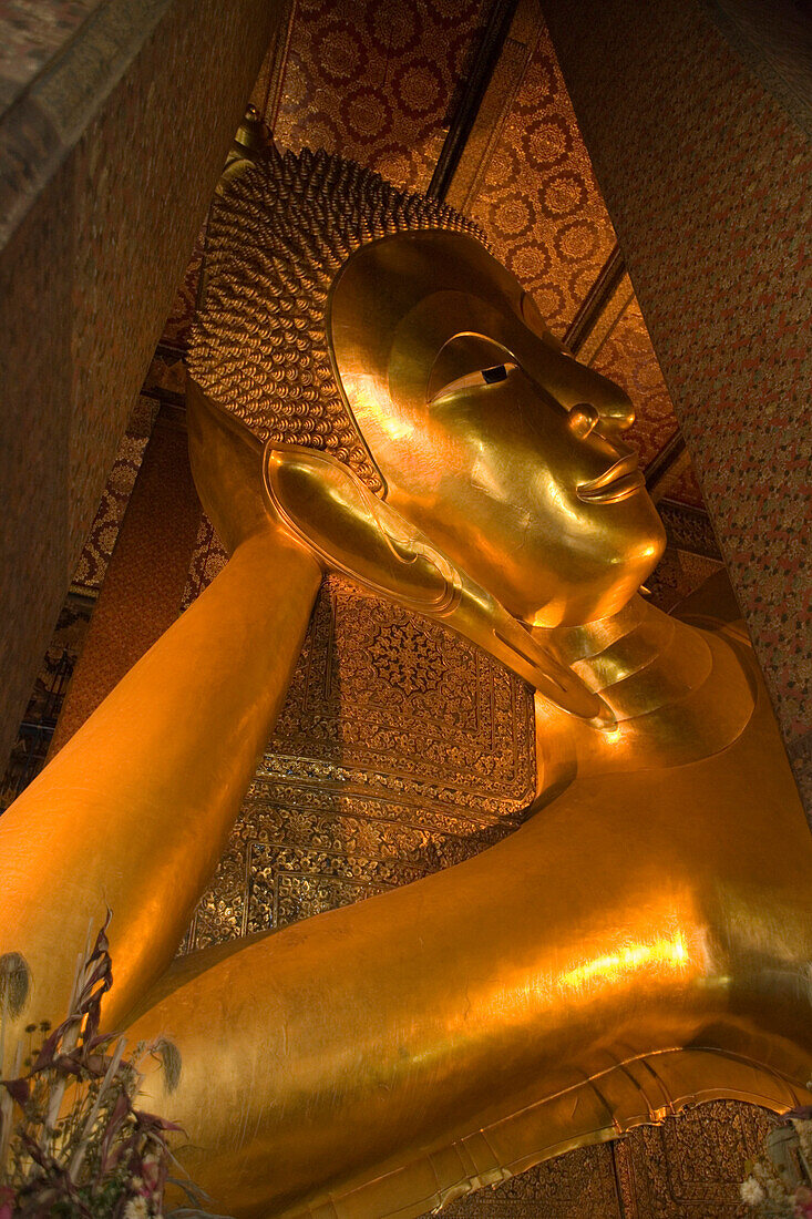 Part of the golden Reclining Buddha, Wat Pho, The Temple of the Reclining Buddha, the largest and oldest wat in Bangkok, Bangkok, Thailand