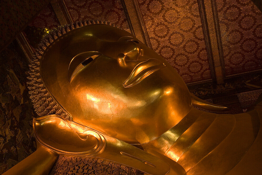 Part of the golden Reclining Buddha, Wat Pho, The Temple of the Reclining Buddha, the largest and oldest wat in Bangkok, Bangkok, Thailand