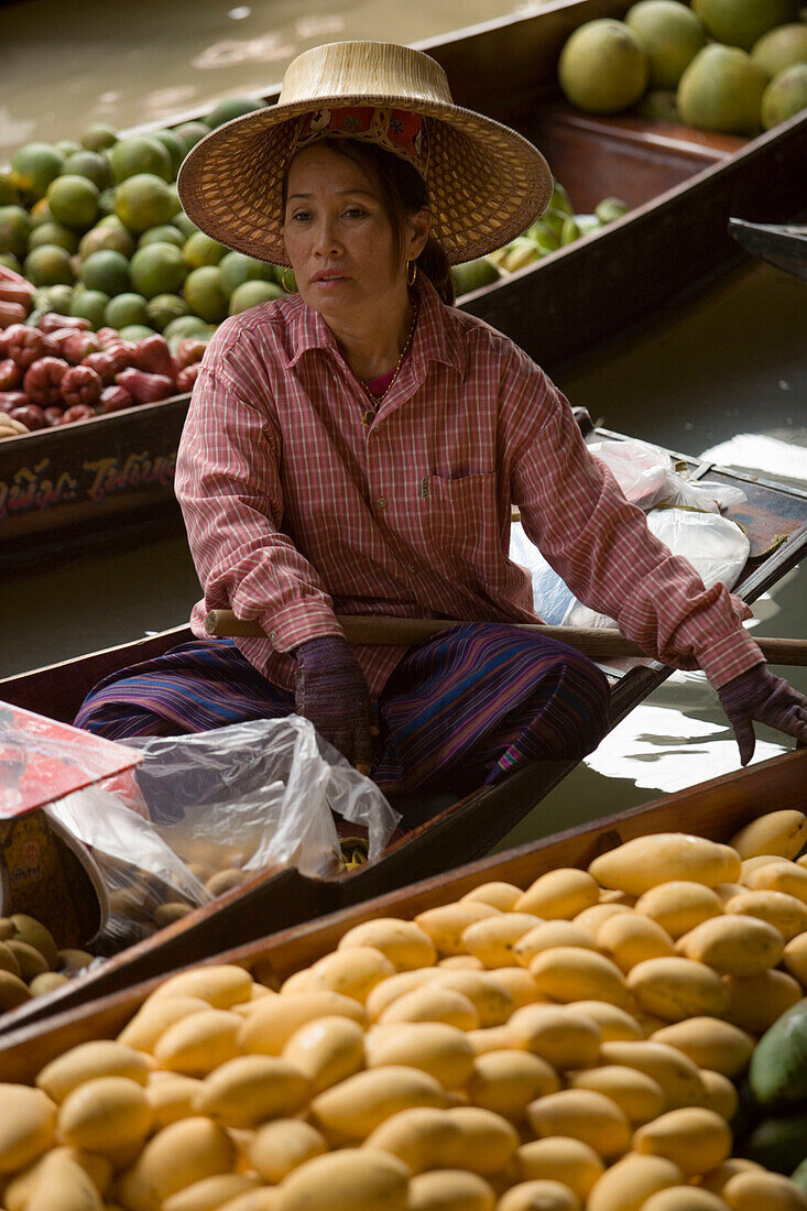 Woman offering fruits at Floating Market, Damnoen Saduak, near Bangkok, Ratchaburi, Thailand