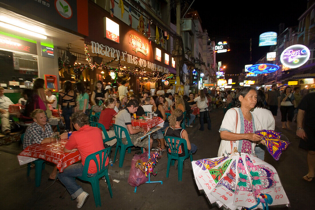 View inside the busy Th Khao San Road with restaurants and street vendors in the evening, Banglamphu, Bangkok, Thailand