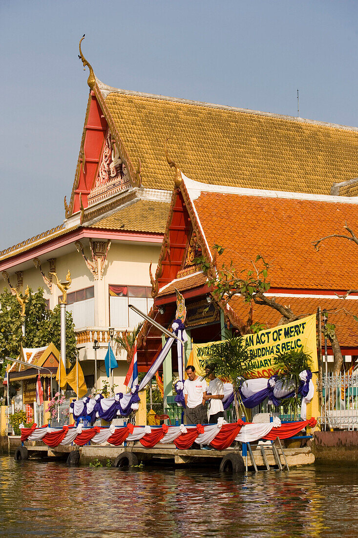 View over Chao Phraya River to a Temple, Thon Buri, Bangkok, Thailand