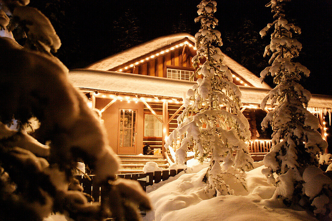 Illuminated log cabin, Alberta, Canada