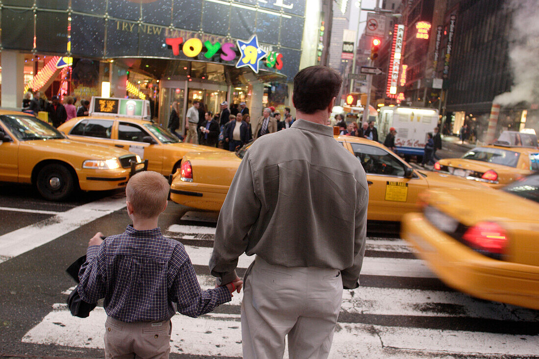Toys are us, Father and son, crossing, Taxi, Yellow Cab, Shopping, Rush hour, Times Square, Manhattan, New York City, New York, United States of America, U.S.A.