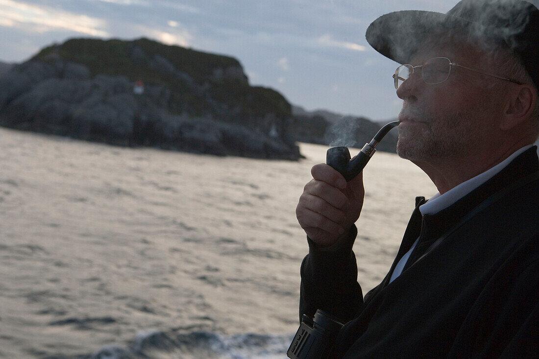 Man with Pipe Admiring Norwegian Coastline, Aboard MS Bremen Cruise Ship, Hapag-Lloyd Kreuzfahrten, Germany