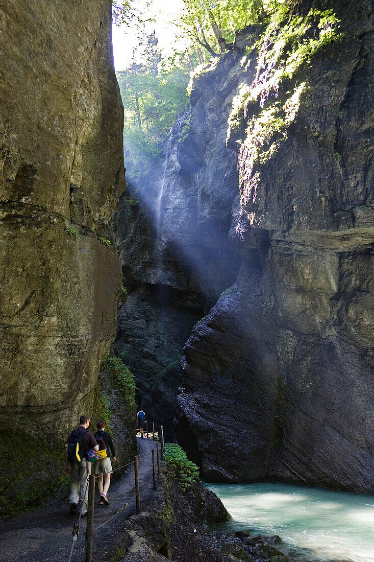 hiking in Partnachklamm gorge near Garmisch Partenkirchen, Upper Bavaria, Germany