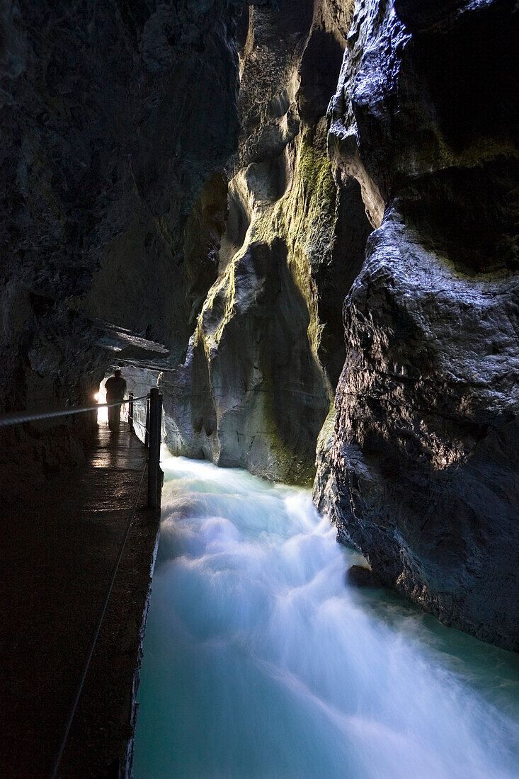 hiking in Partnachklamm gorge near Garmisch Partenkirchen, Upper Bavaria, Germany