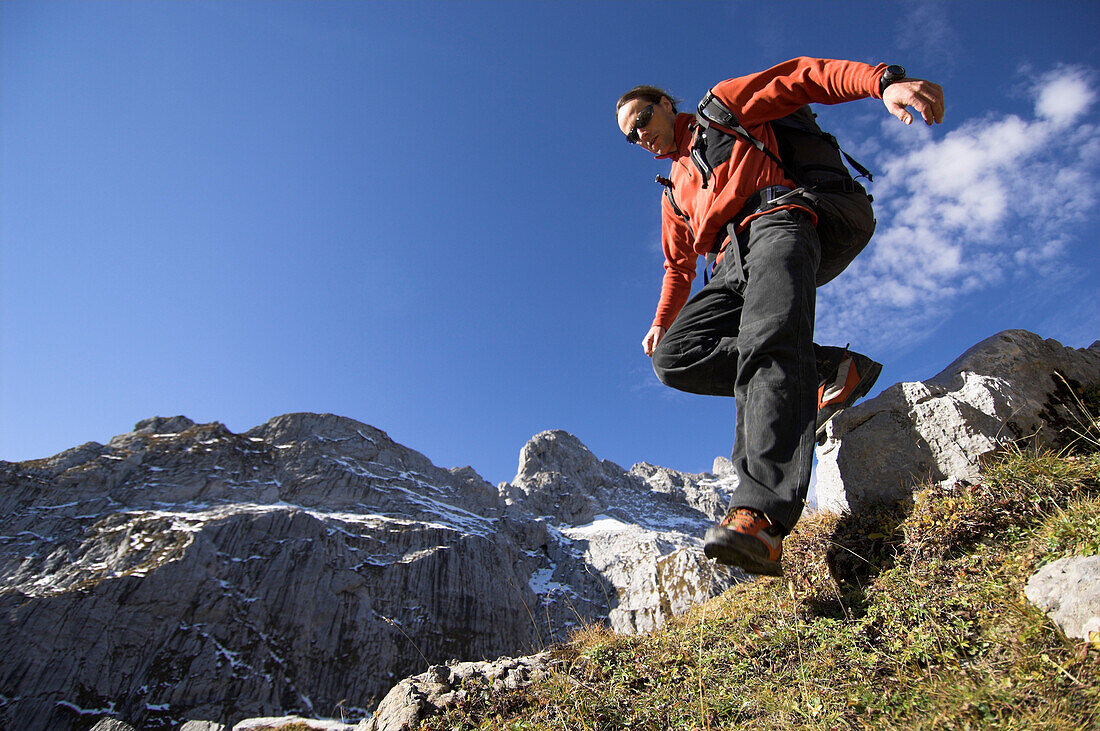 A mountaineer descending a mountain, Ratikon, Switzerland