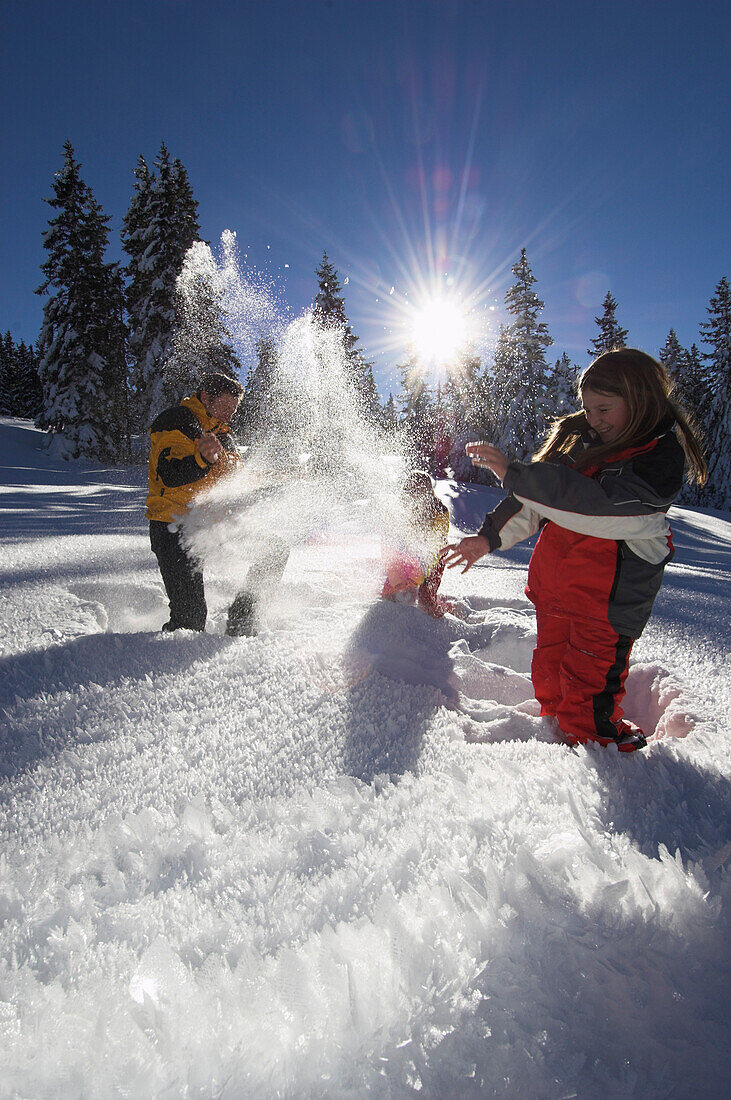 A family having fun in the snow, Kasberg, Upper Austria, Austria