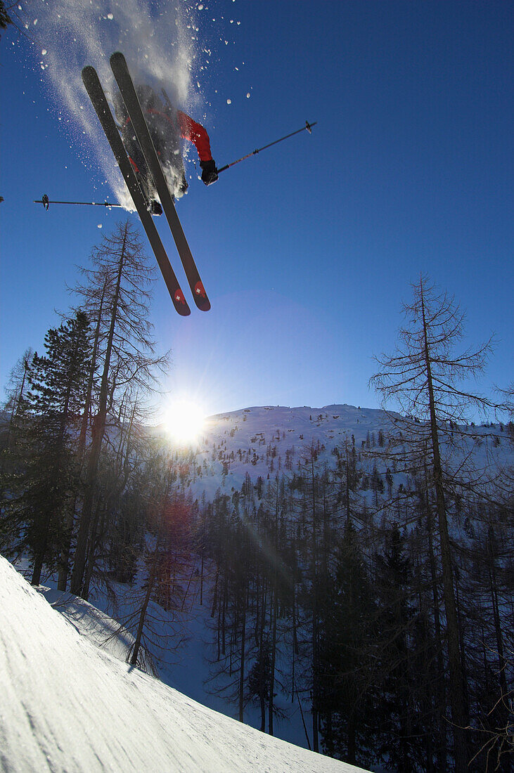 A skier, freerider performing a jump in a winter landscape, Krippenstein, Dachstein, Obertraun, Upper Austria, Austria