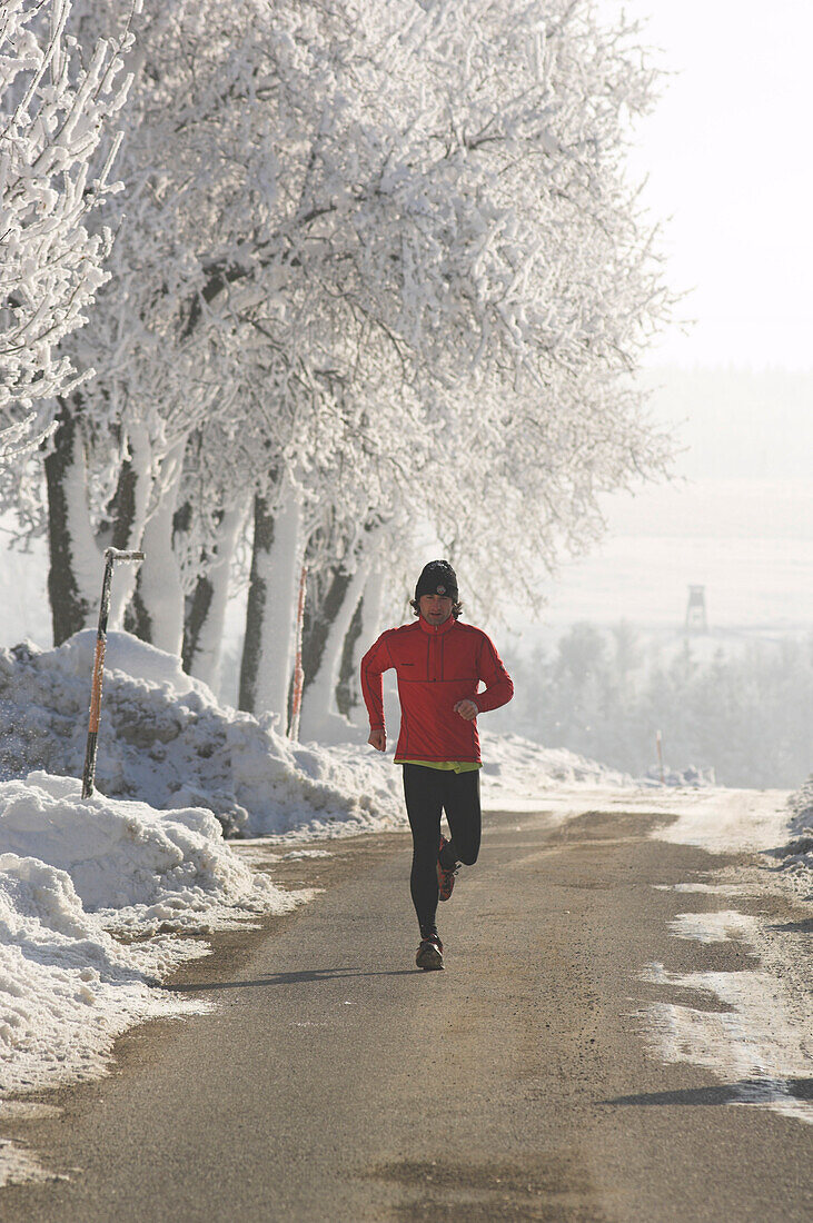 Male jogger in winter, Upper Austria