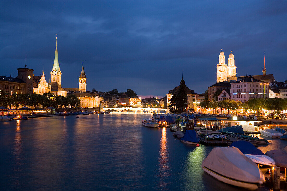 View over river Limmat to Fraumunster, St. Peter church and Grossmunster in the evening, Zurich, Canton Zurich, Switzerland