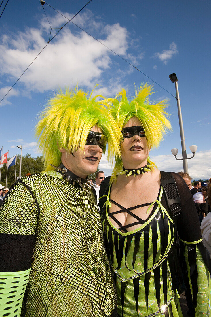 Flashy dressed up couple with yellow hairs at Street Parade (the most attended technoparade in Europe) near Quai Bridge, Zurich, Canton Zurich, Switzerland