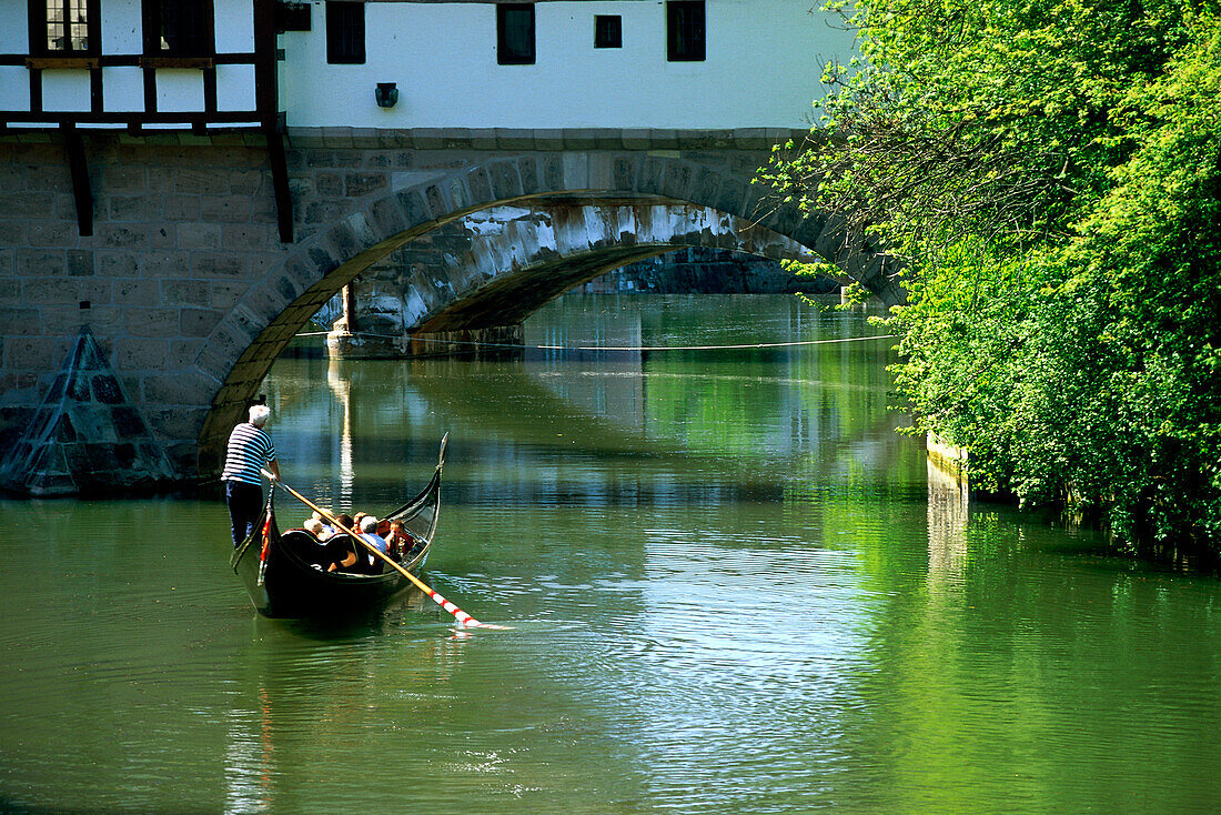 A gondola on the river Pegnitz at Henkersteg, Nuremberg, Franconia, Bavaria, Germany