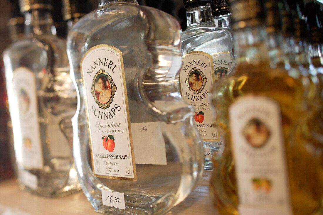 Bottles with Nannerlschnaps in a souvenir shop, St. Gilgen, Wolfgangsee, Salzburg, Austria