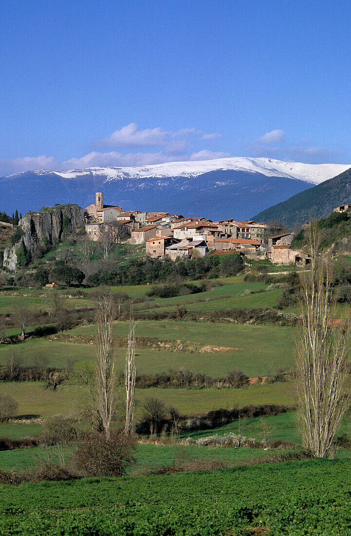 Peramea with snow covered Pyrenees mountains, Pyrenees, Spain