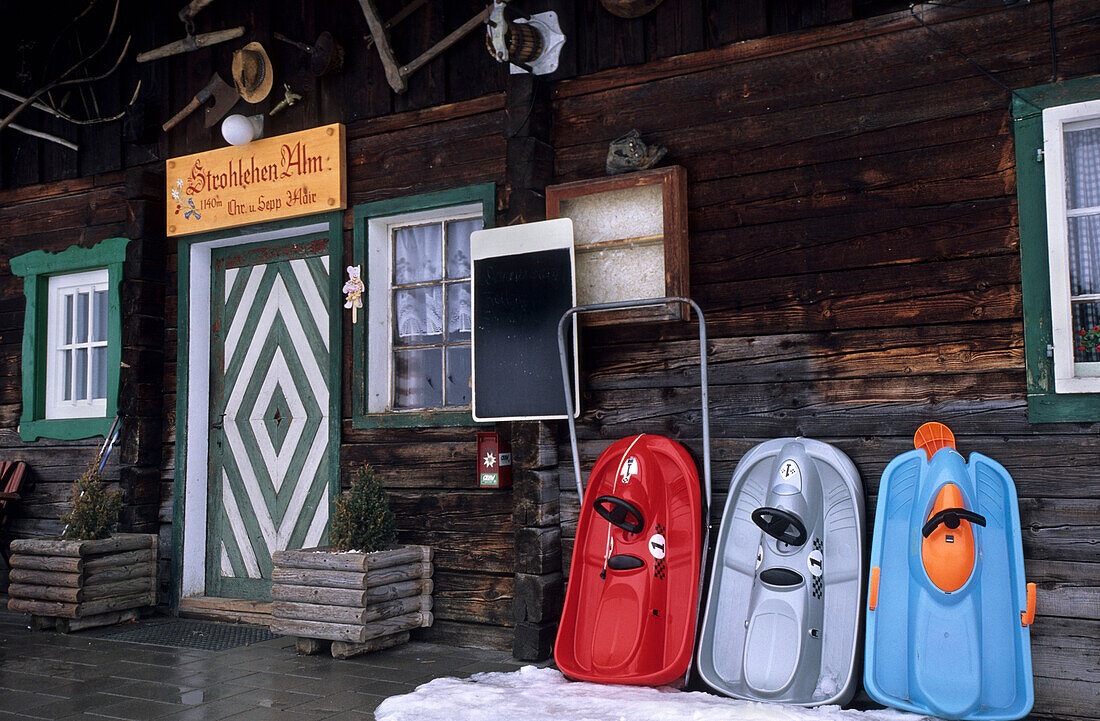 Bobsleds in front of Strohlehen hut, Dorfgastein, Gasteiner valley, Salzburg, Austria