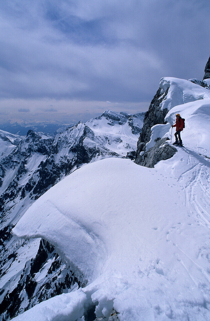 Backcountry skier on corniced ridge, Hochkalter, Berchtesgaden range, Upper Bavaria, Bavaria, Germany