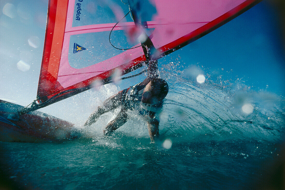 Windsurfer performing a turn, hand in water, Windsurfing, Sport