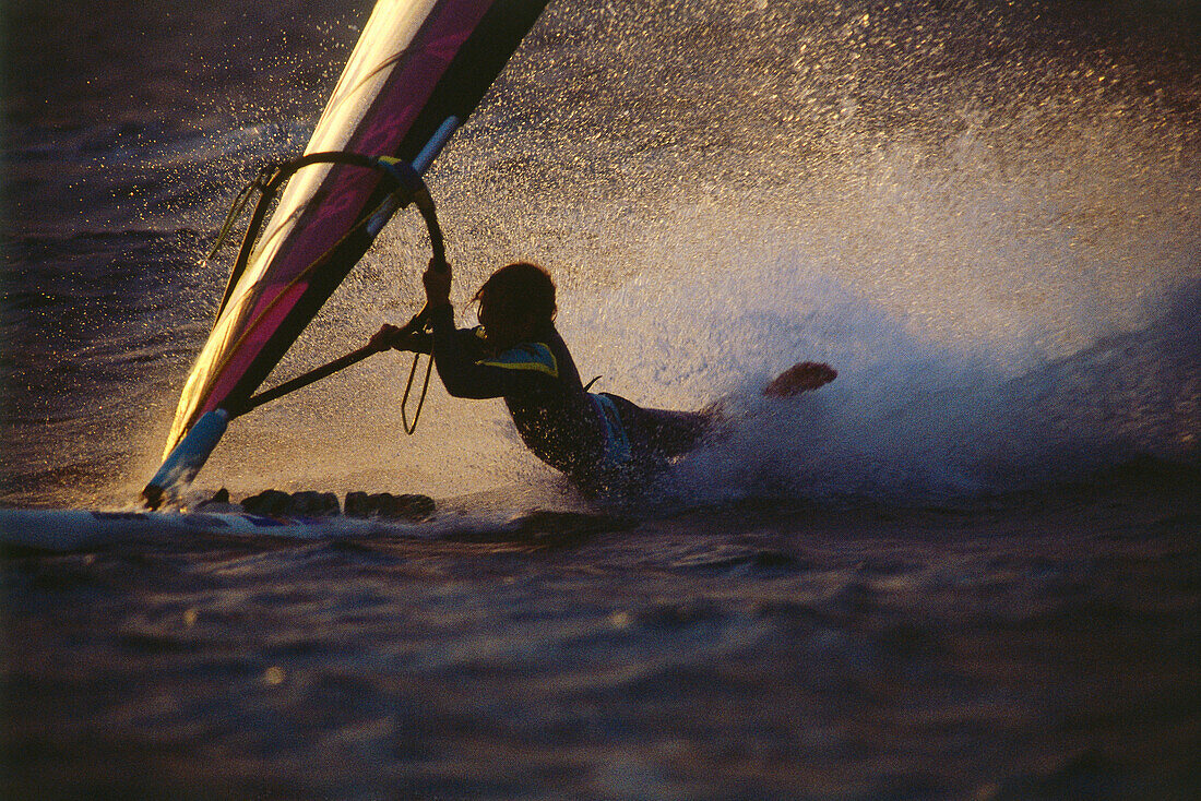 Windsurfer splashing into the water, bodydrag