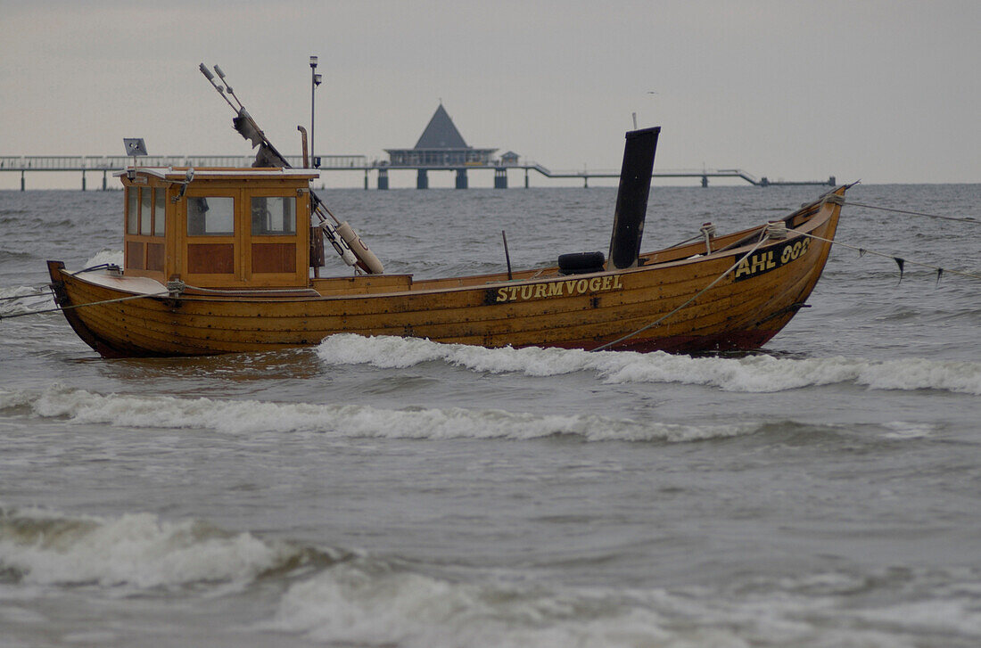 Fishing boat with Heringsdorf pier in the background, Ahlbeck, Isle of Usedom, Mecklenburg-Pomerania, Germany, Europe