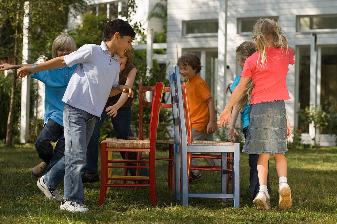 Children playing Musical Chairs, … – License image – 70058703 Image ...