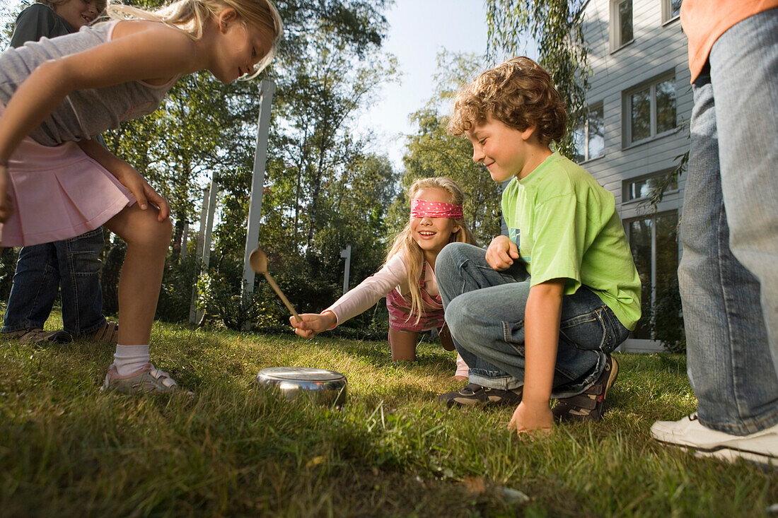 Children playing Hit the Pot, children's birthday party