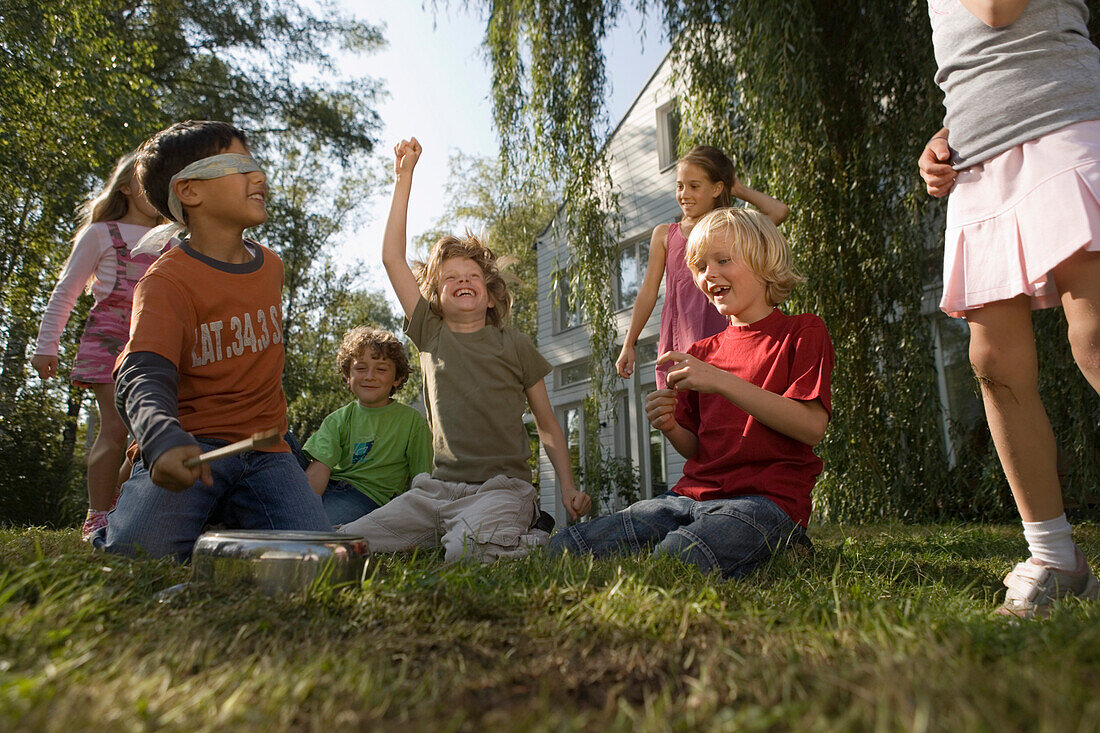 Children playing Hit the Pot, children's birthday party