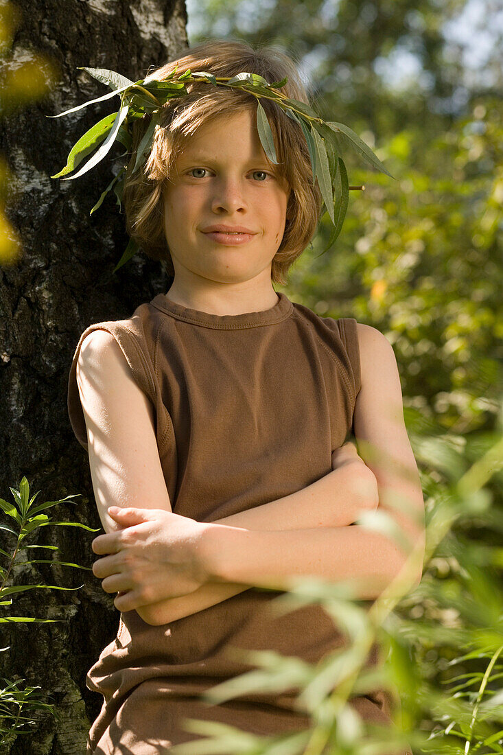 Boy wearing a leaf wreath, portrait