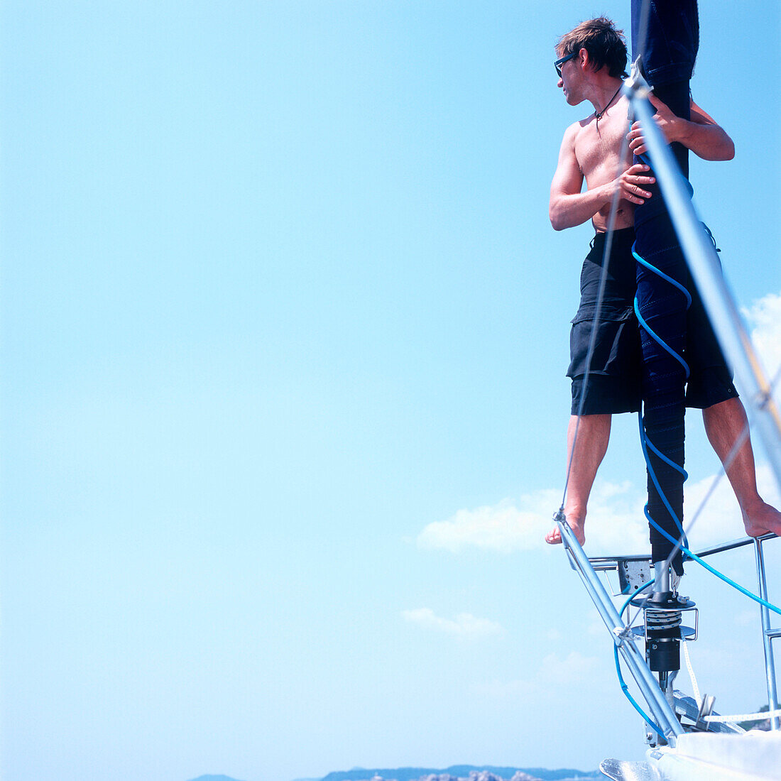 Man standing on sailboat's railing an lookin at view, Adriatic Sea, Dalmatia, Croatia