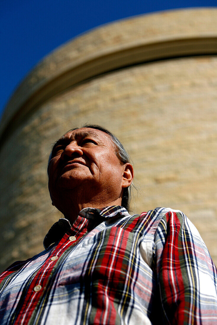 A Native American outside the National Museum of the American Indian, Washington DC, United States, USA