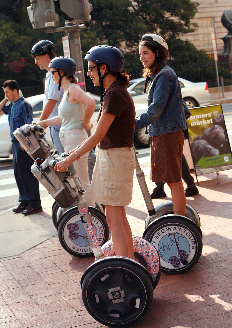 Young people on Segway personal transporters, Downtown, Washington DC, United States, USA