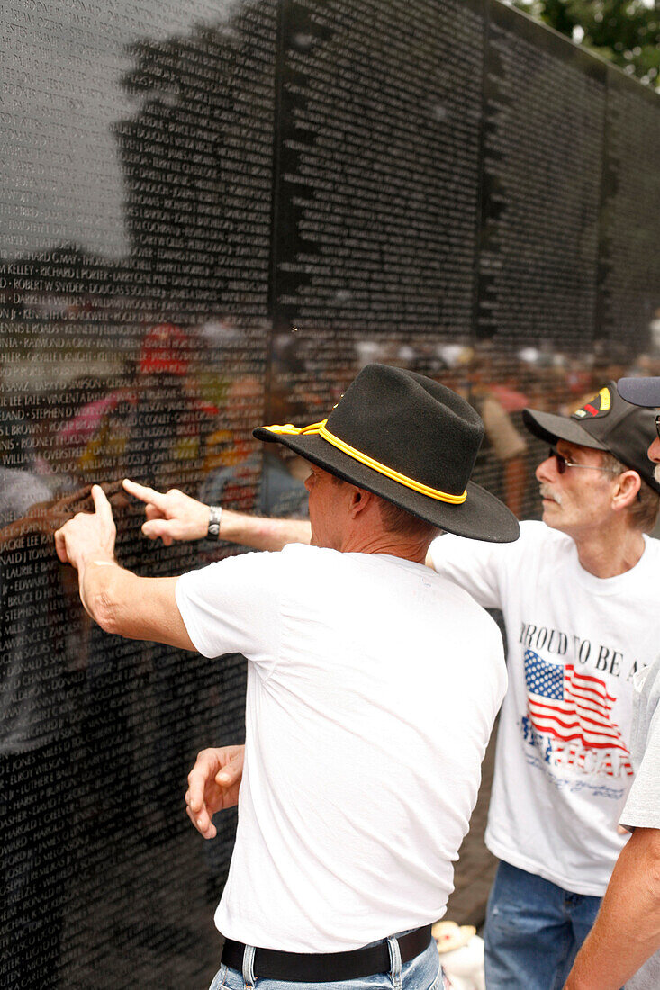 Two men at the Vietnam Veterans Memorial, Washington DC, United States, USA