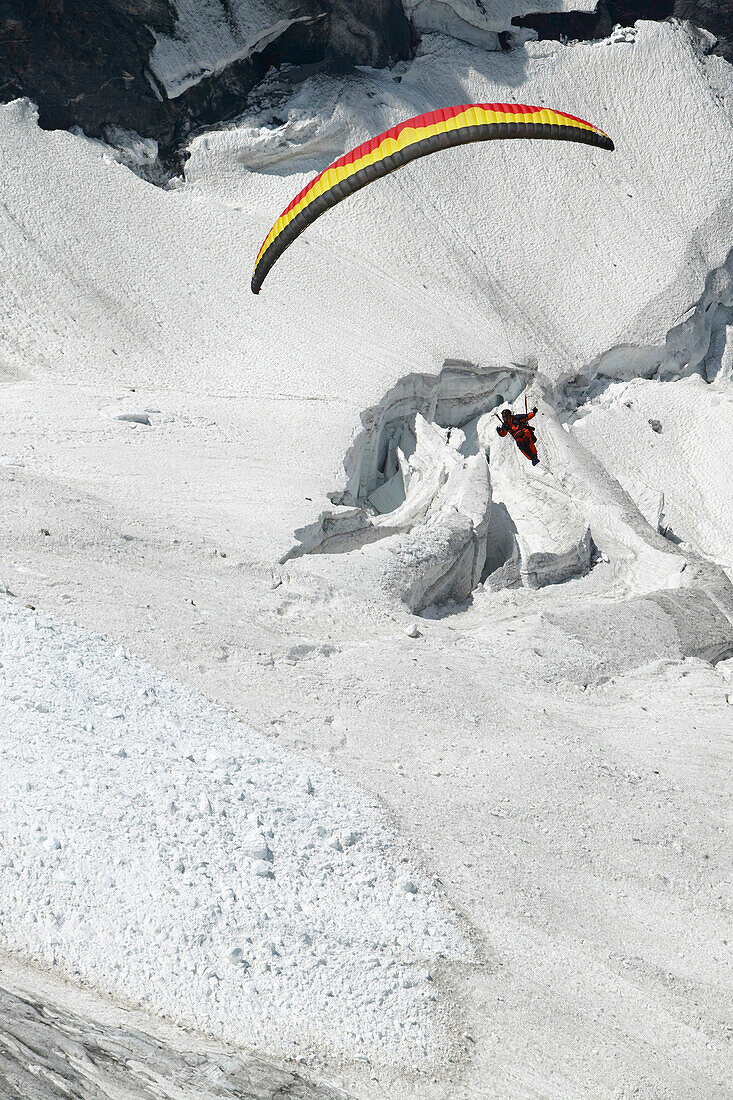 Paragliding above glacier, Jungfrauspitze, Interlaken, Berne Canton, Switzerland