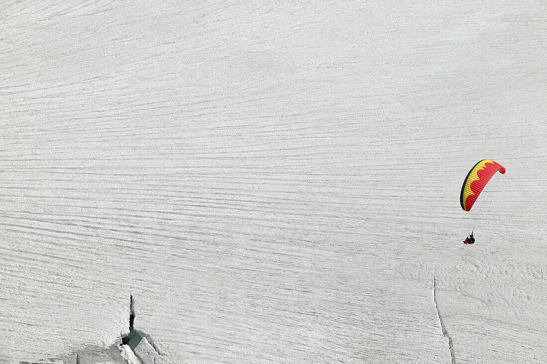 Paragliding above glacier, Jungfrauspitze, Interlaken, Berne Canton, Switzerland