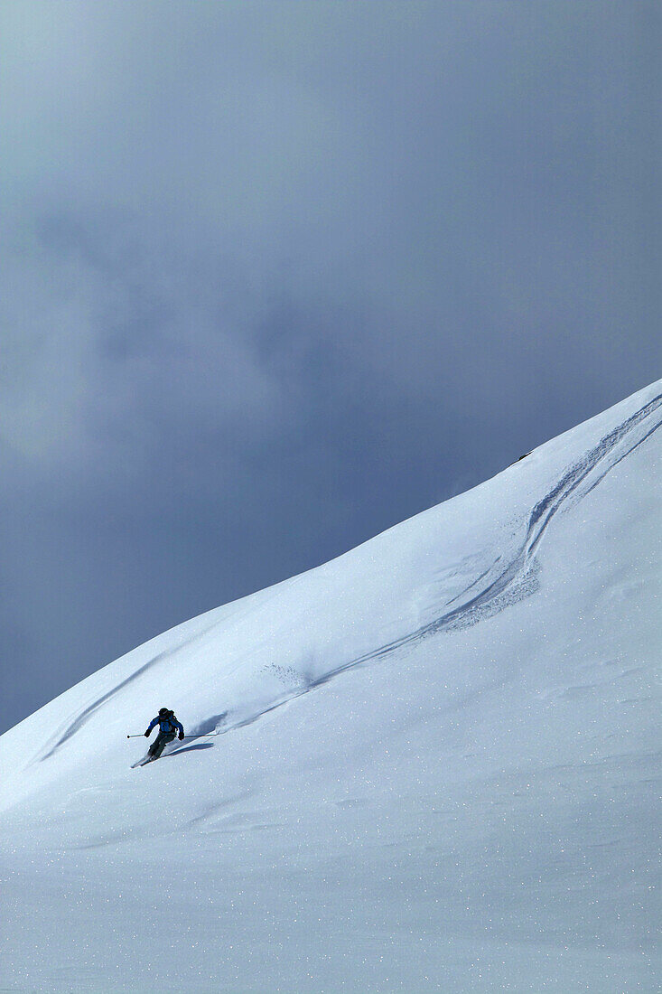 Skier on deep snow, Chandolin and Saint-Luc ski resort, Canton of Valais, Switzerland