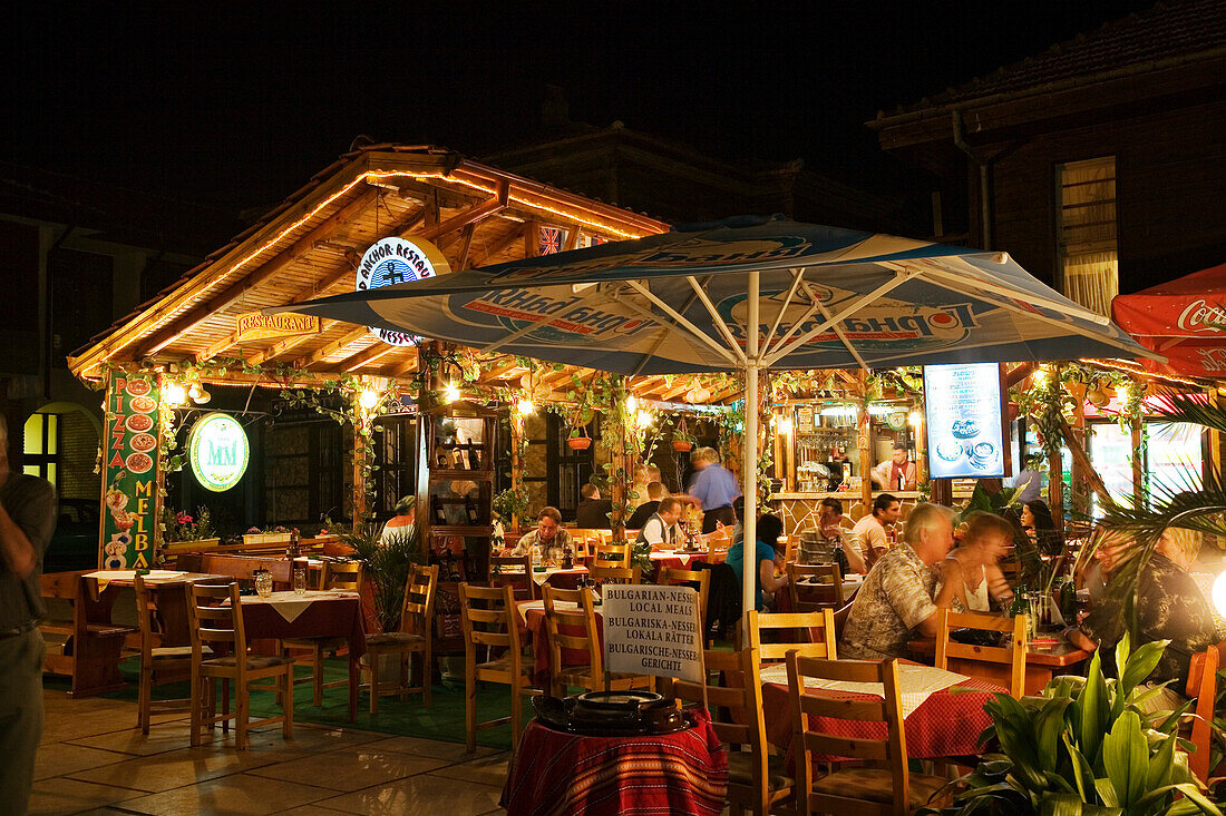 People at a restaurant at night, Town museum Nesebar, Black Sea, Bulgaria, Europe