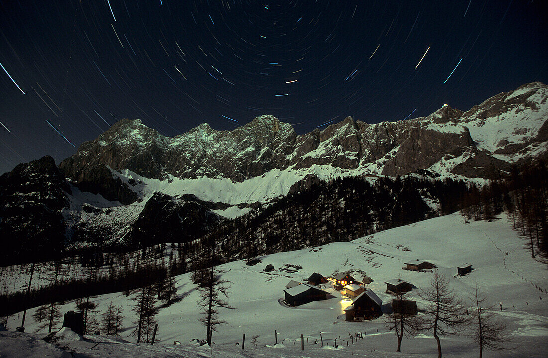 alpine huts of Neustattalm with Dachsteinrange at night with stars, Dachstein range, Styria, Austria