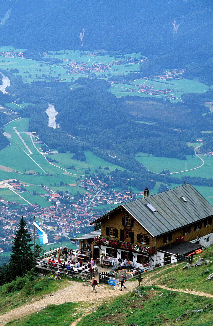 hut Hochgernhaus with hikers resting on the terrace, Chiemgau, Upper Bavaria, Bavaria, Germany