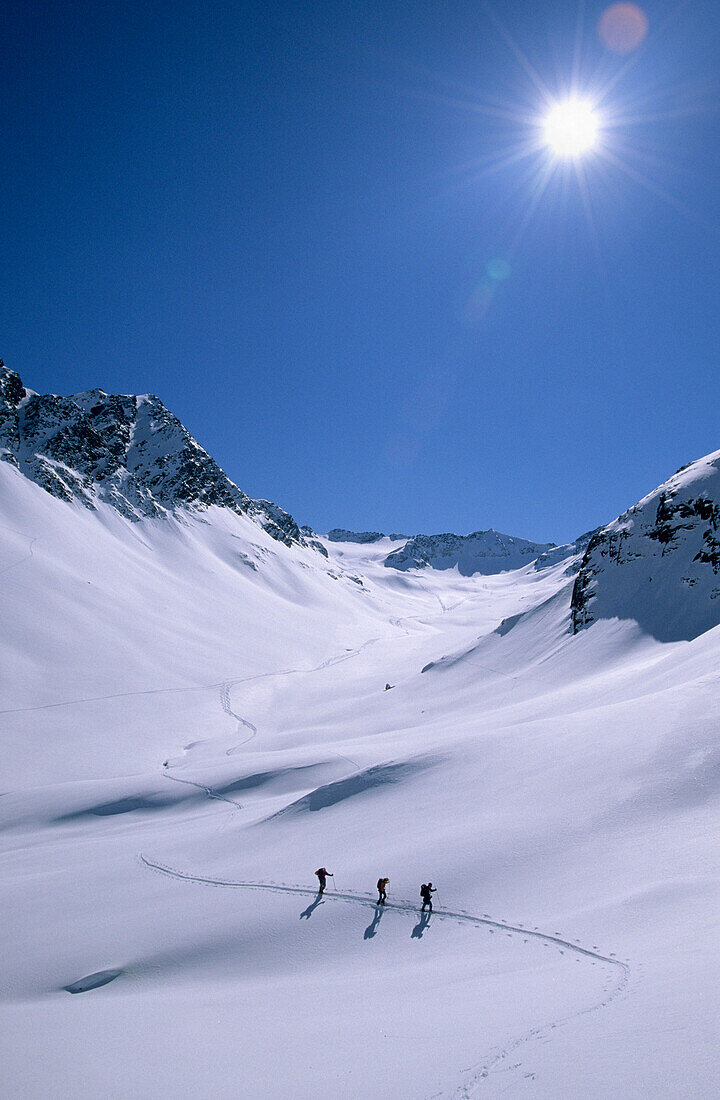 Three back-country skier in valley Pollestal, Oetztal Range, Tyrol, Austria