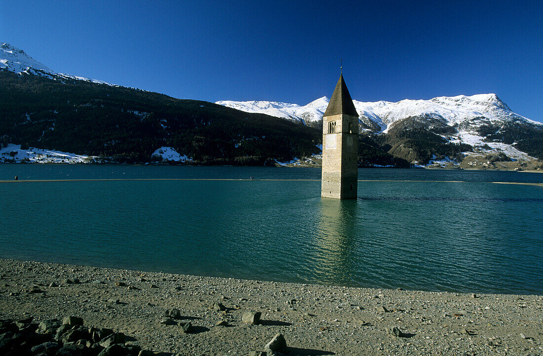 church tower in lake Reschensee, Graun, South Tyrol, Italy