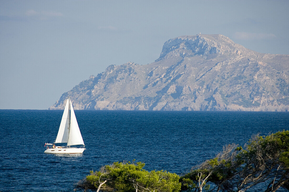 Sailing boat off shore, Cap des Pinar, mountain Atalaia d'Alcudia, Majorca, Balearic Islands, Spain, Europe