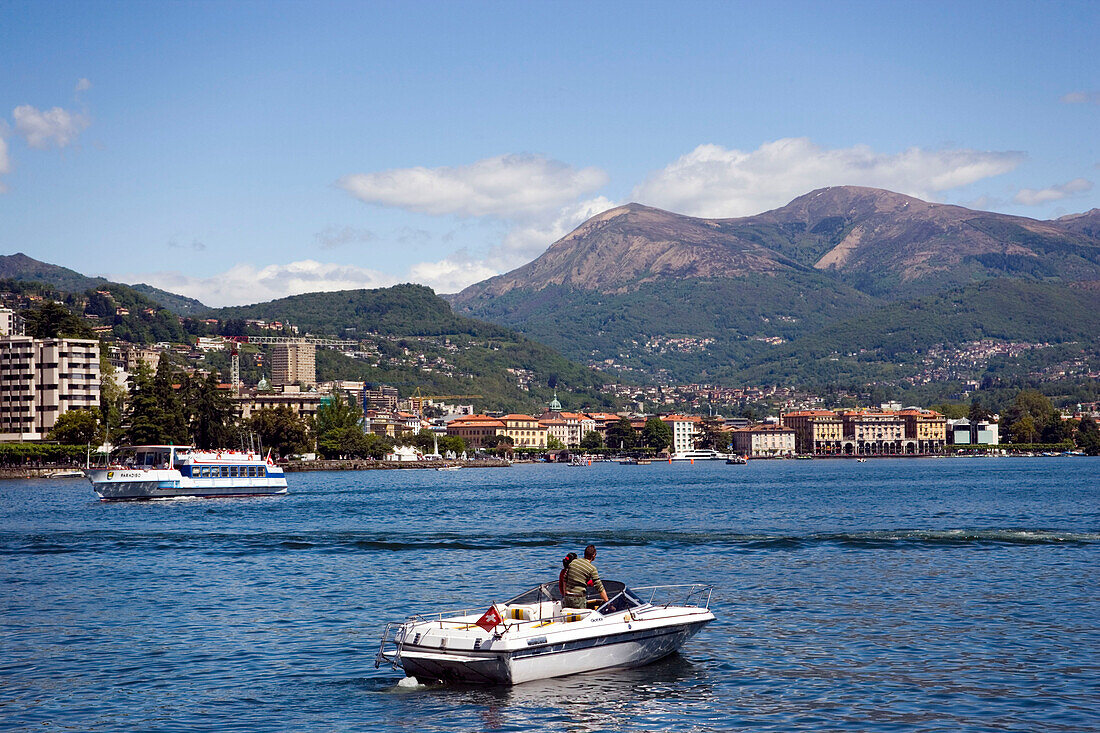 Motorboat and excursion boat on Lake Lugano, Lugano, Ticino, Switzerland